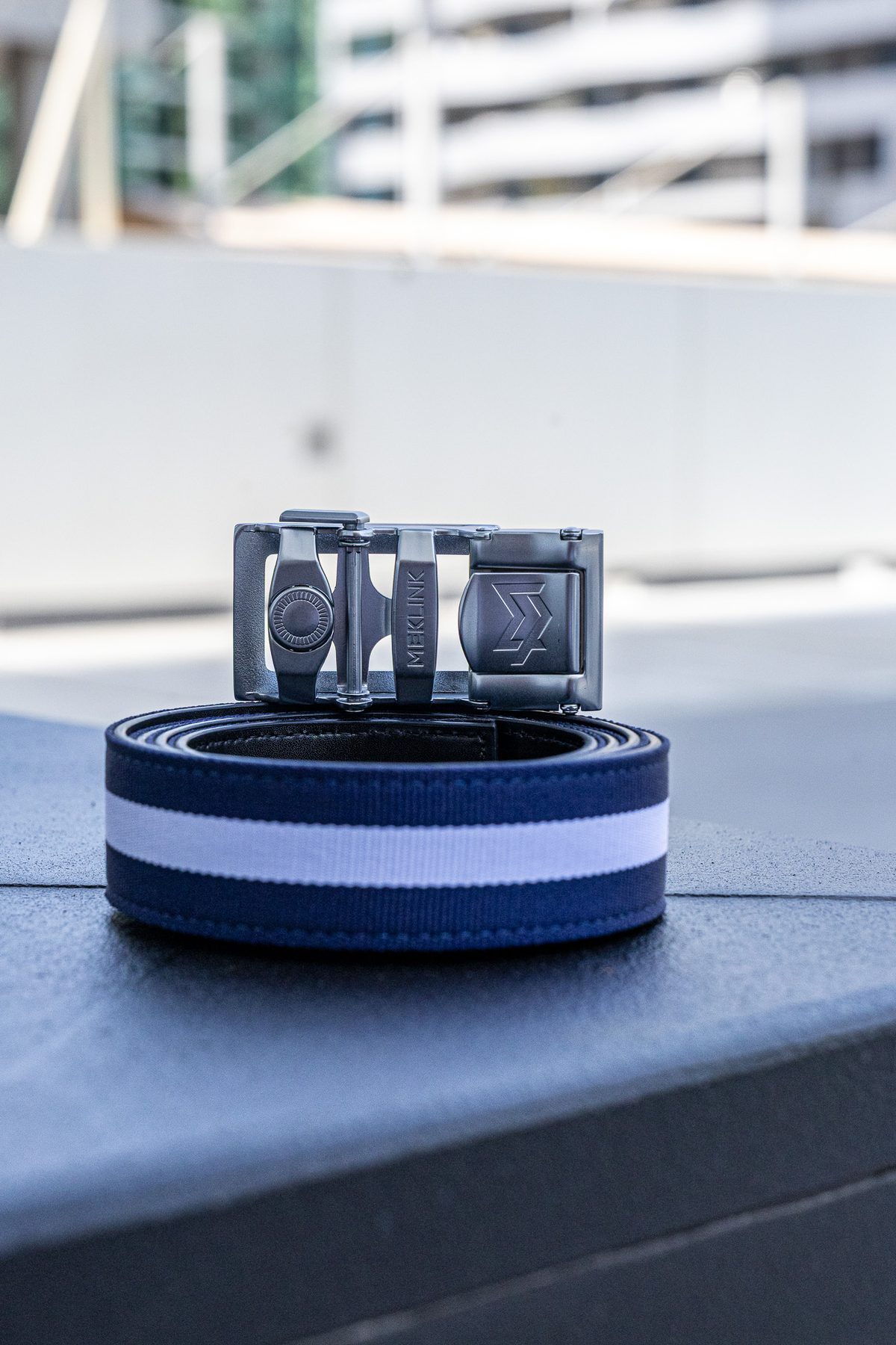 Navy-white stripe MEKLINK with silver buckle, Dubai rooftop